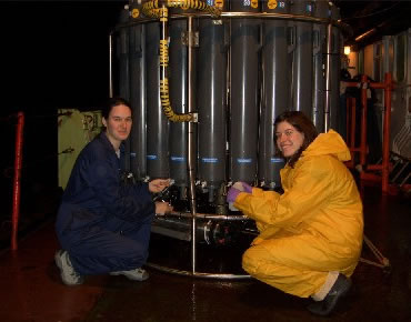 Photo of Susan Leadbetter and Rhiannon Mather taking samples of water on the RRS Darwin